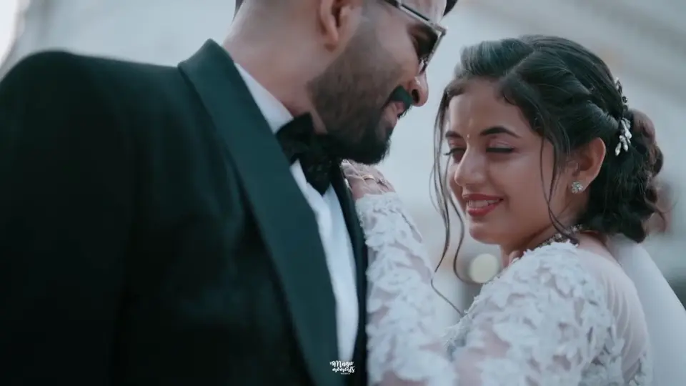 A bride and groom smiling together outside