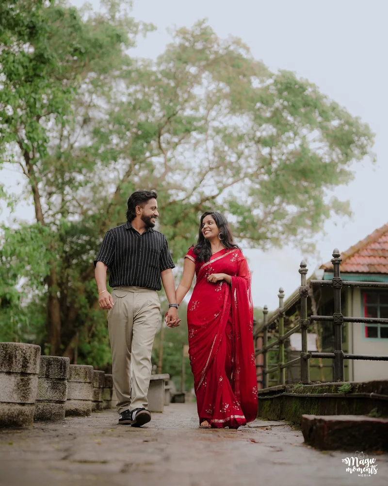 A couple walking together beside a traditional courtyard